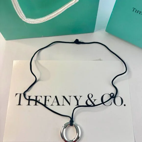 Tiffany & Co. Elsa Peretti Sevillana pre-own silver pendant with silk black cord